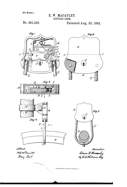 Patent drawing of a shield-shaped bicycle lock showing internal tumblers and bolts, a U-shaped hasp passing through the lock body, and a mounting clamp attaching the lock to a bicycle's steering head with the hasp threaded between wheel spokes.